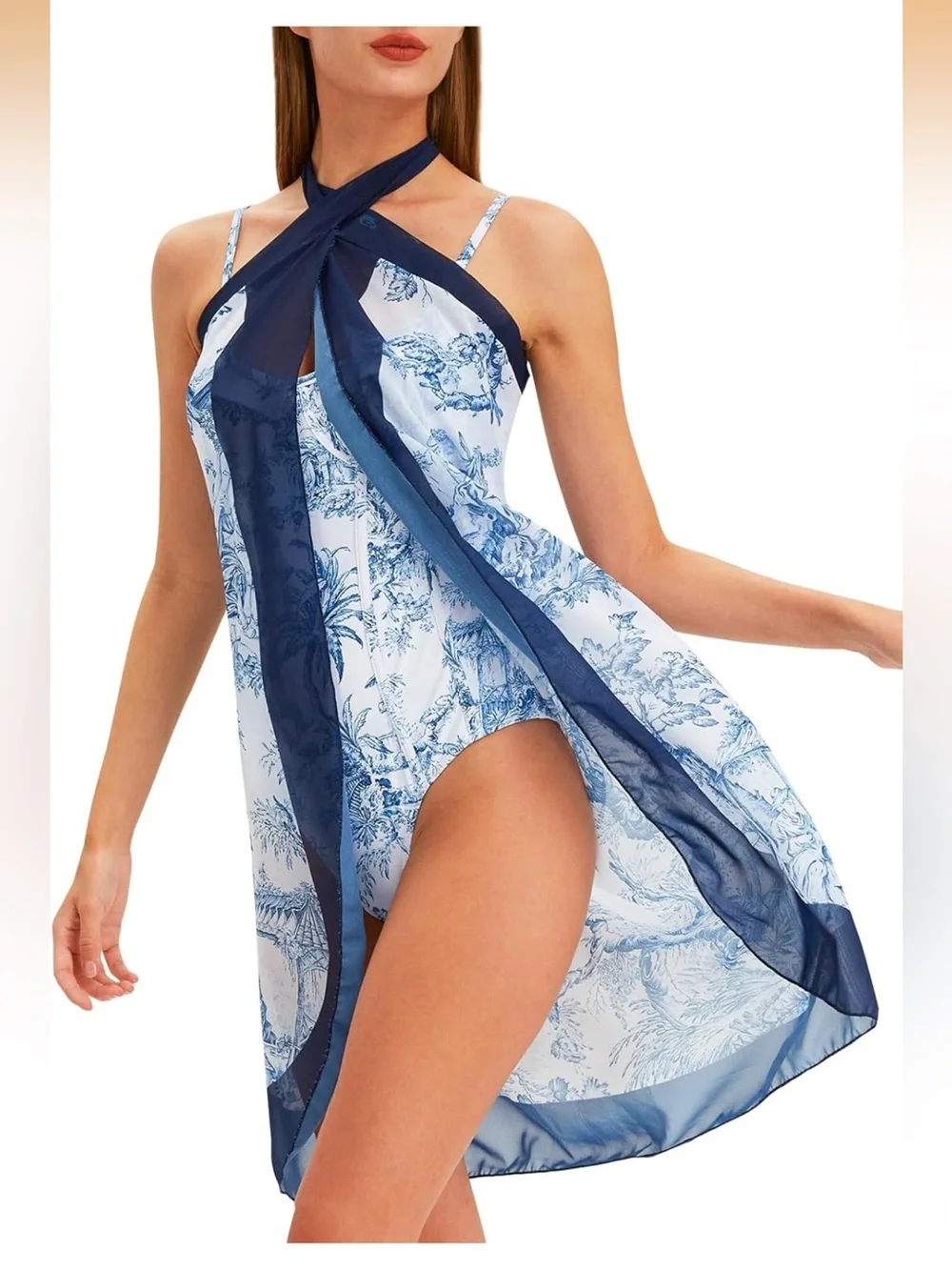 White and navy onepiece swimsuits with matching coverup.